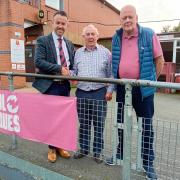 Elwyn Morgan (centre) with Newtown Football Club chairman Nick Evans and committee member Nigel Bevan.