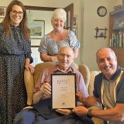 Tom Evans finally received his Points of Light award from Steve Hughson, watched by MP Fay Jones and his daughter Amanda Thomas, earlier this year.