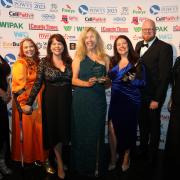 FieldMouse Research co-founder Sarah Morris (holding the award) pictured with colleagues and Alison Jones (far right) from Welshpool Printing Group, sponsor.