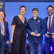 Mason Davies with his award, pictured with BBC Breakfast presenter Jon Kay and Guide Dogs trustees Kerry Small and Kate Crofts.