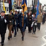 The parade marches through Welshpool on  Remembrance Day 2023.