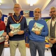 Llanfyllin Mayor Peter Lewis with authors Richard Kretchmer, Pauline Page Jones and Dave Goodman.