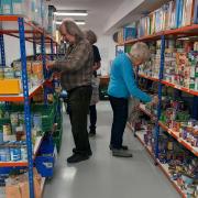 Volunteers picking food parcels at Llandrindod Foodbank.