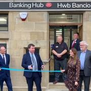 Cutting the ribbon on Welshpool's Bank Hub.