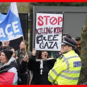 People take part in a protest opposite the Israeli ambassadors residence, as part of the Stop the War campaign.