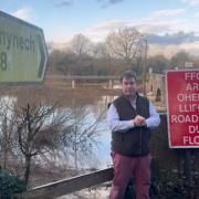 Montgomeryshire MP Craig Williams at a flood scene in Llanymynech.