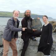 Dr. Eamon Doyle (left), Dr. Joseph Botting (centre), and Dr. Lucy Muir (right) with the new fossil sponges discovered near the Cliffs of Moher in County Clare.