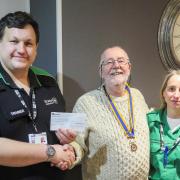 St John Ambulance Service trainers Dan Harper and Sindy Traylor, being presented with a cheque by Builth Wells Rotary Club president Ciaran O’Connell.