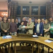 Llanidloes Town Council present a cheque for £2,000 to Llanidloes Youth Club secretary Cllr Kelly Hawkins.