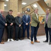Cllr David Selby, Cabinet Member for a More Prosperous Powys, welcomes the five new town centre liaison officers, Bobby Gough, Philip Jones, Richard Morgan, Rhys Howells and Ayden Davies to their roles.