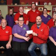 Rhayader Carnival committee members present a cheque to staff at Rhayader Community Nursery.