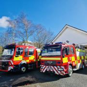 Machynlleth Fire Station's old MAN Rescue Appliance next to their new Volvo engine.