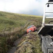 Car being recovered from the ditch on Forge Road, near Machynlleth.