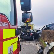 The impact of the collision led to one of the vehicles landing on a hedge.