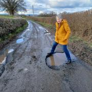Councillor Heather Kidd with one of the many potholes in south-west Shropshire.