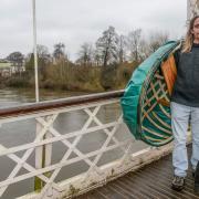Peter Reddings with his coracle by the River Wye.