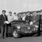 Welshpool & District Motor Club gathered around an Austin Healey Sprite in 1964. Picture by Don Griffiths.