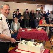 CFO Roger Thomas kindly cuts station's birthday cake for for everyone to enjoy.