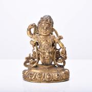 This Tibetan gilt bronze figure of Padmasambhava .