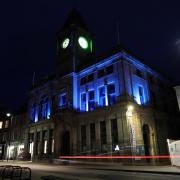 Welshpool Town Hall illuminated in blue for World Parkinson's Day.