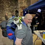 St Idloes Lodge member Mike Rutland and Gibson the cat, at Berkeley Castle in Gloucestershire.