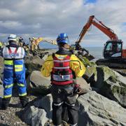 Rescuers used diggers to save a girl trapped on the beach at Tywyn