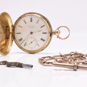 A Robert Roskells 18 carat gold hunter pocket watch which sold for £1,350.