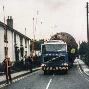 This week’s Memory Lane photo is a bit of a mystery.The photo shows an Econofreight specialist heavy haulage lorry, with a 1983 registration, making its way through Welshpool.We’re not sure what the strange load is or where it was heading – can any