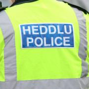 Dyfed-Powys Police officers are at the scene.
