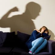 PICTURE POSED BY MODEL ..File photo dated 09/03/15 of a shadow of a man with a clenched fist as a woman cowers in the corner. PRESS ASSOCIATION Photo. Photo credit: Dominic Lipinski/PA Wire.