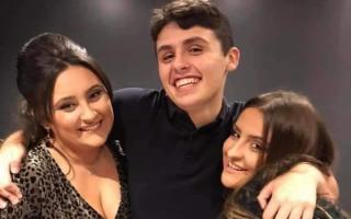 Dylan Price pictured with his sisters. Pic by the Price family