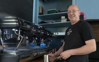 Wil Wild with the crowdfunded coffee machine at The Wild Oak Cafe in Llanidloes