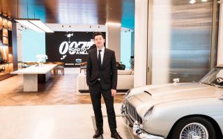 Series director Julian Jones at Aston Martin’s flagship showroom in London with James Bond’s iconic DB5