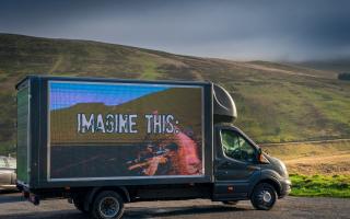 A Fly-tipping Action Wales digi-van featuring super-imposed images of fly-tipping appeared at the base of Pen-y-Fan.