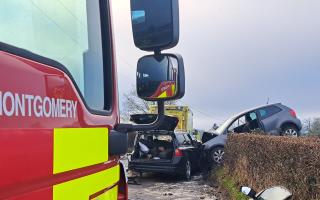 The impact of the collision led to one of the vehicles landing on a hedge.