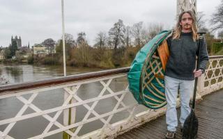 Peter Reddings with his coracle by the River Wye.