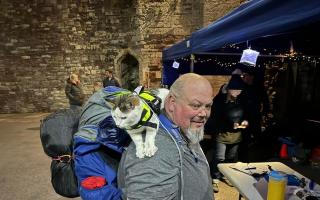 St Idloes Lodge member Mike Rutland and Gibson the cat, at Berkeley Castle in Gloucestershire.