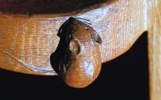 Robert 'Mouseman' Thompson's iconic furniture designs feature a characteristic mouse carved on them. Picture above is an example of a mouse carved by Thompson.